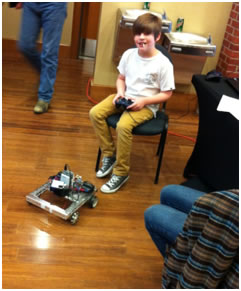 FLL Student driving one of our robots at the Arkansas State FLL Championship Tournament.